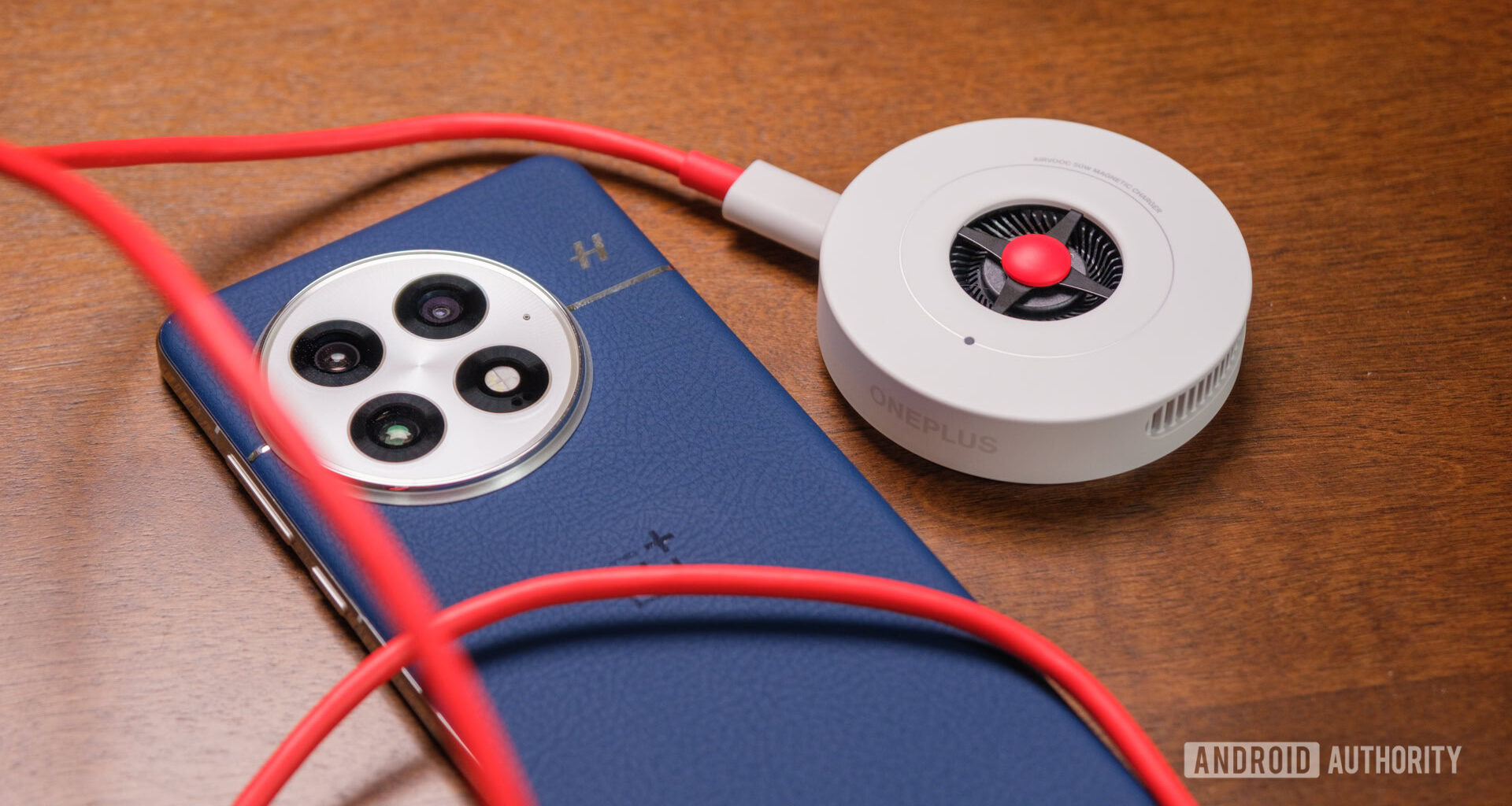OnePlus 13 with red cable and charger