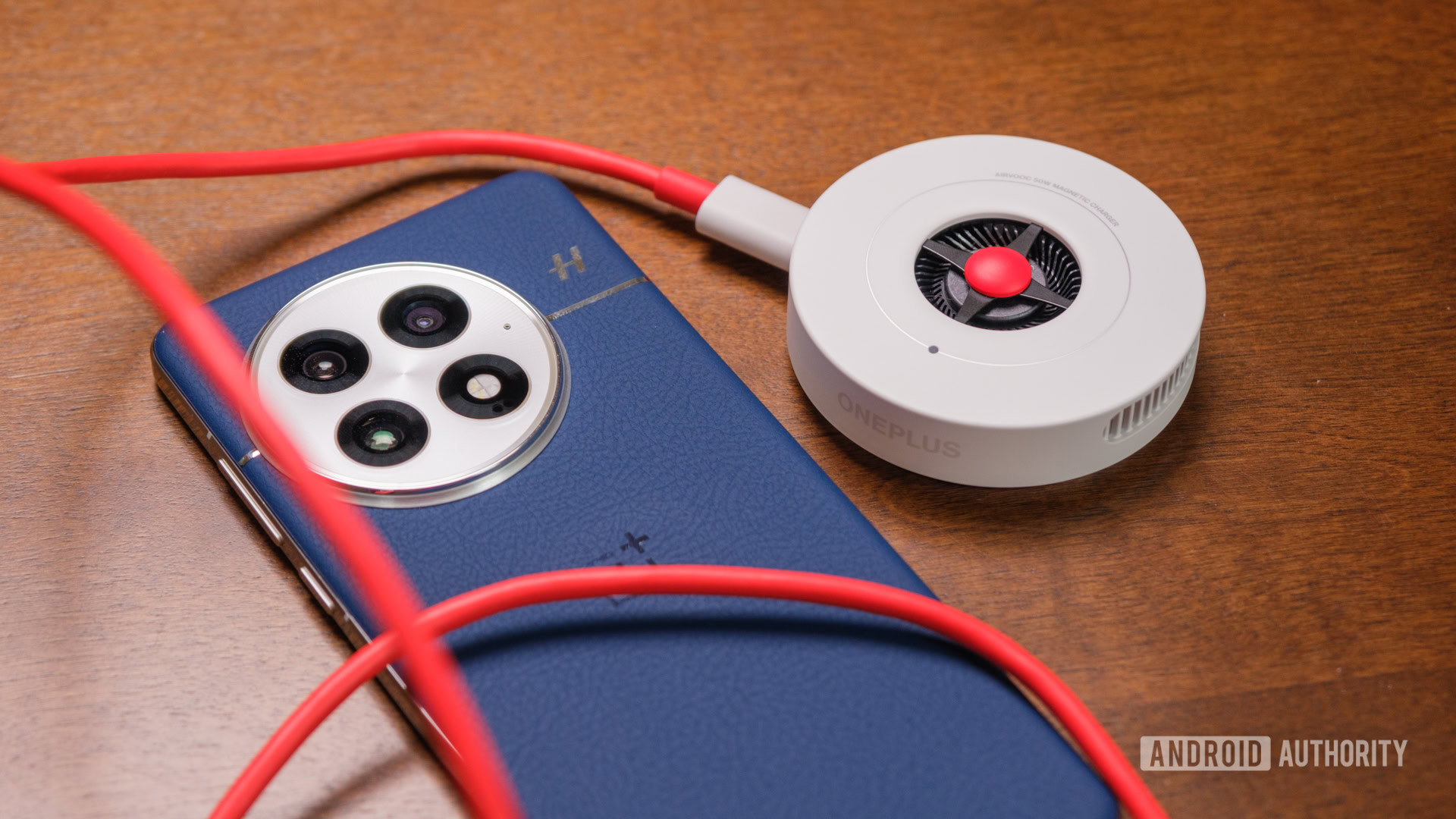 OnePlus 13 with red cable and charger