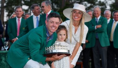 Rory McIlroy of Northern Ireland poses with daughter Poppy and wife Erica Stoll holding the Masters trophy during the Green Jacket Ceremony after winning the 2025 Masters Tournament