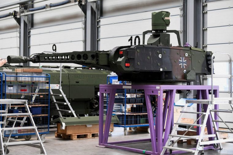 FILE PHOTO: An view of a Puma fighting vehicle's cannon at a production line as German Chancellor Olaf Scholz and Defence Minister Boris Pistorius visit the future site of an arms factory where weapons maker Rheinmetall plans to produce artilleries from 2025, in Unterluess, Germany February 12, 2024. REUTERS/Fabian Bimmer/Pool/File Photo
