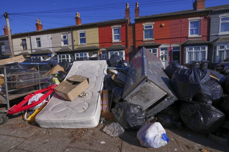 Rubbish piles up on a residential street in Birmingham, England, Monday, April 7, 2025, amid an ongoing refuse workers' strike in the city. (AP Photo/Kirsty Wigglesworth)