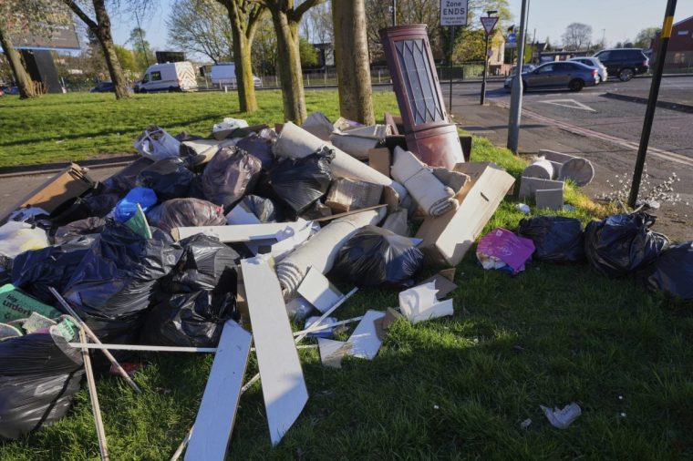 Rubbish piles up on a street in Birmingham, England, Monday, April 7, 2025, amid an ongoing refuse workers' strike in the city. (AP Photo/Kirsty Wigglesworth)