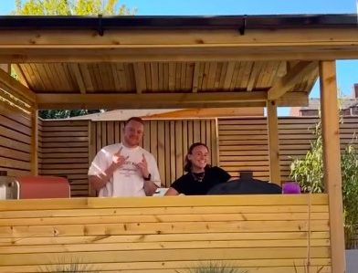 Colson Smith and Ellie Leach pose in a garden