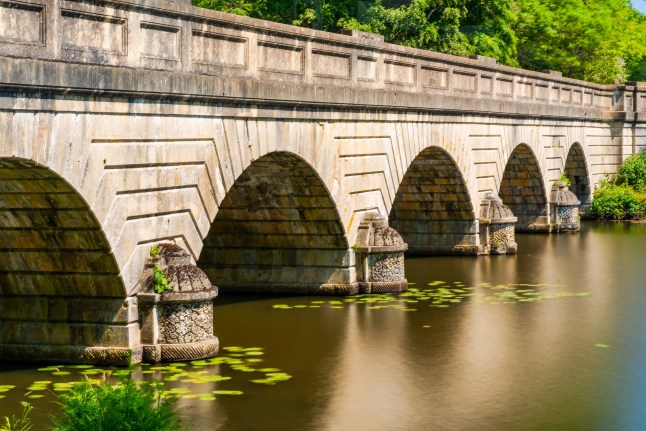 Five-arch bridge over Virginia Water lake in Surrey, UK. Long exposure effect; Shutterstock ID 1983673751; purchase_order: -; job: -; client: -; other: -