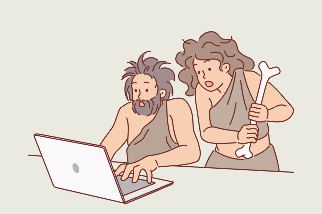 Neanderthal people use laptop and shocked to learn new technologies, for concept of time travel. Ancient neanderthal man and woman dressed in animal skins, learned about existence of internet