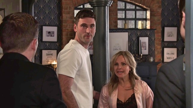 Kit and Sarah looking at Todd and Theo in surprise in Coronation Street