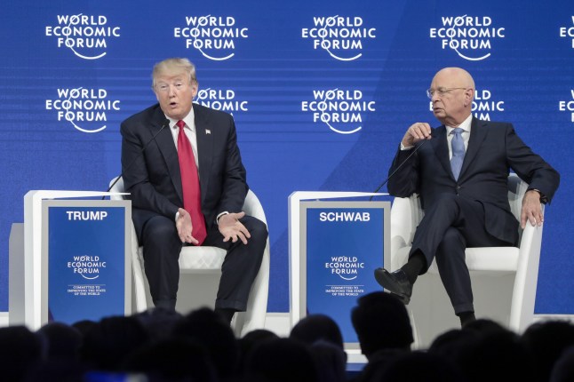 U.S. President Donald Trump, left, speaks with Klaus Schwab, chairman of the World Economic Forum (WEF), during a special address on the closing day of the World Economic Forum (WEF) in Davos, Switzerland, on Friday, Jan. 26, 2018. World leaders, influential executives, bankers and policy makers attend the 48th annual meeting of the World Economic Forum in Davos from Jan. 23 - 26. Photographer: Jason Alden/Bloomberg via Getty Images