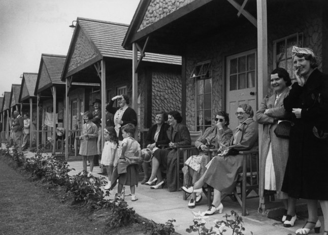 Families outside their huts at Butlin's Holiday Camp, Skegness, 1939. Original Publication: Picture Post - 193 - Holiday Camp - pub. 5th August 1939 (Photo by Felix Man/Picture Post/Hulton Archive/Getty Images)