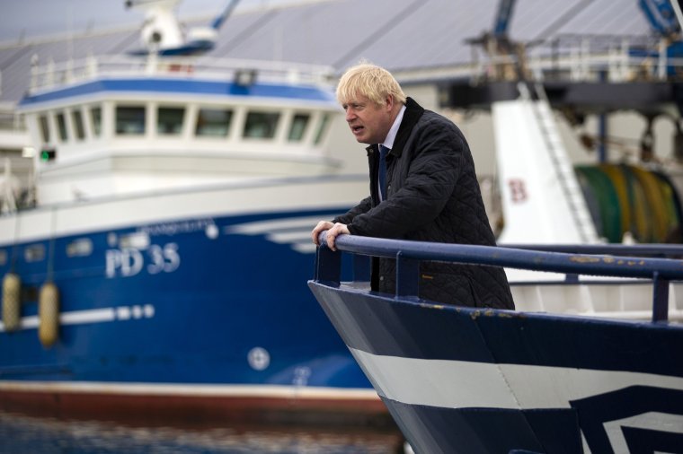 Britain's Prime Minister Boris Johnson looks on from aboard the Opportunis IV fishing trawler during a visit to Peterhead in Scotland on September 6, 2019. - Prime Minister Boris Johnson heads to Scotland on Friday in campaign mode despite failing to call an early election after MPs this week thwarted his hardline Brexit strategy. (Photo by Duncan McGlynn / POOL / AFP) (Photo credit should read DUNCAN MCGLYNN/AFP via Getty Images)
