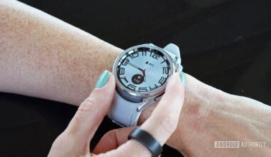 A Samsung Galaxy Watch 6 Classic displays the Stretched Time watch face.