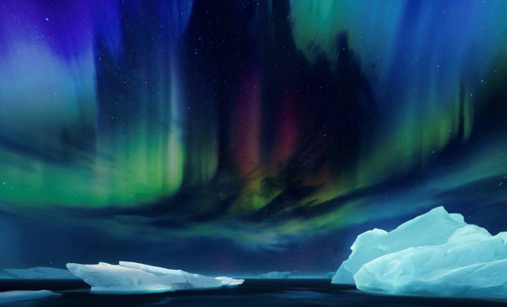 A scene from the film on Antarctica that will soon be showing at Outernet with swirling blue and green skies and icebergs in front