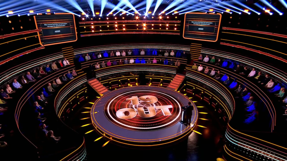 Screenshot of the game show "19 Out" set.