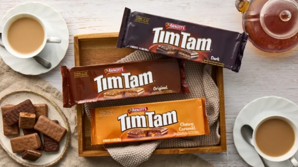 Three boxes of Tim Tam biscuits: Dark, Original, and Chewy Caramel.