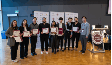 Student startup founders stand in a group, holding certificates after receiving the McMaster Student Seed Fund investment.