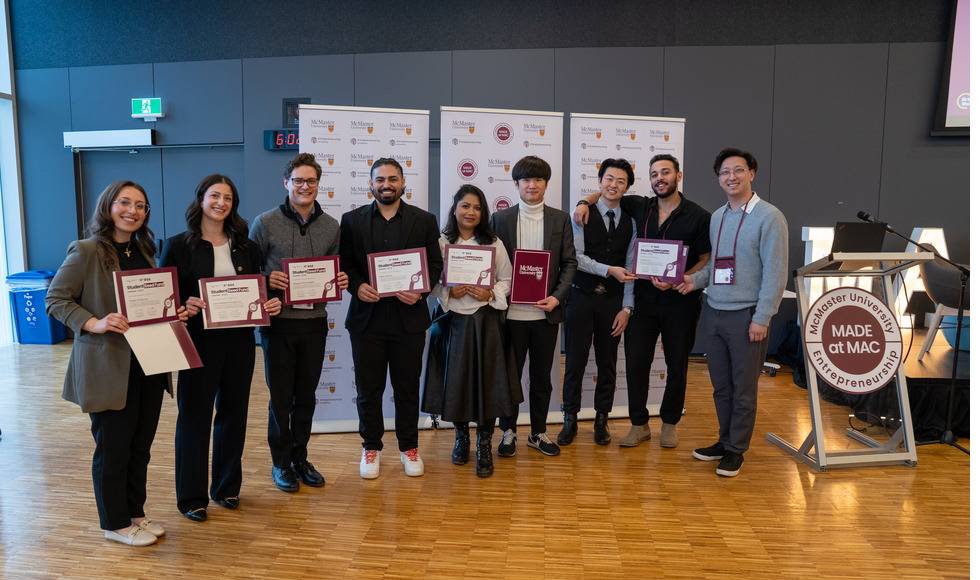 Student startup founders stand in a group, holding certificates after receiving the McMaster Student Seed Fund investment.