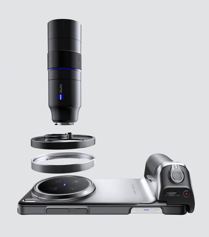 Smartphone with an attached large, detachable camera lens and accessory. The setup illustrates an advanced photography feature. The phone lies flat, showcasing the lens and additional components in a suspended, exploded view above it.