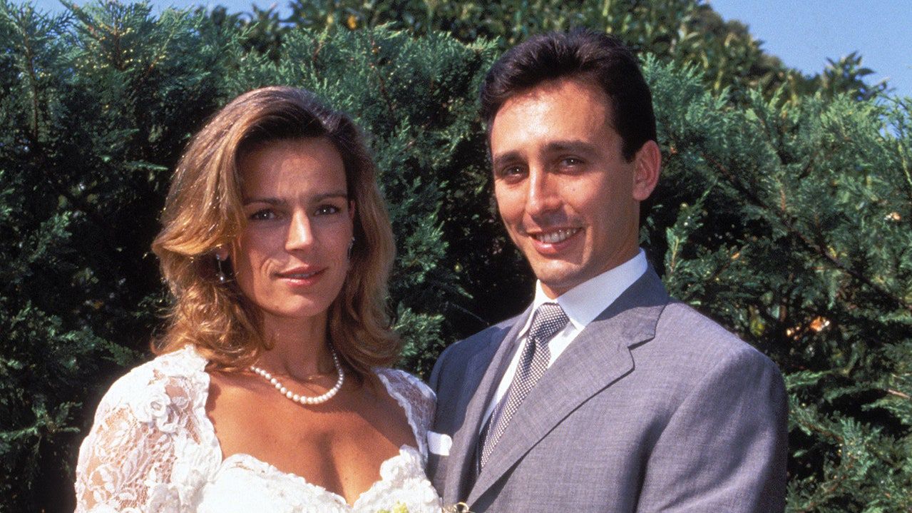 Image may contain: Clothing, Apparel, Human, Person, Tie, Accessories, Accessory, Plant, Fashion, Robe, Gown, and Wedding