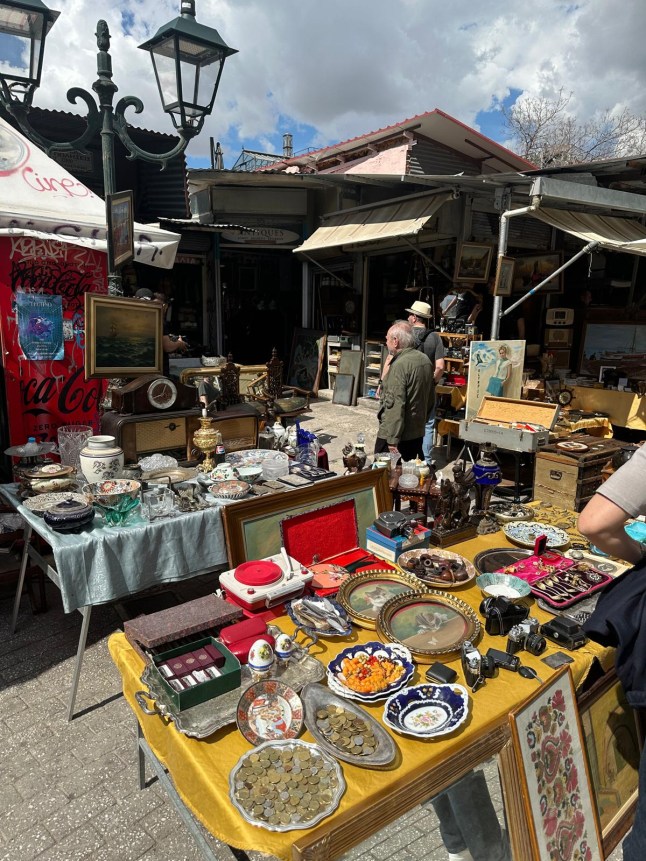 A stall at the Monastiraki flea market in Athens, filled with bric-a-brac
