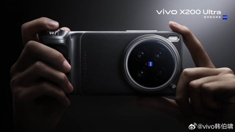 Hands holding a Vivo X200 Ultra smartphone with a prominent camera module on the back. The phone features a sleek design with branding and a dual flash. The background is dark, highlighting the device.