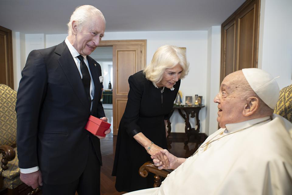 King Charles and Queen Camilla greeting Pope Francis at the Vatican 