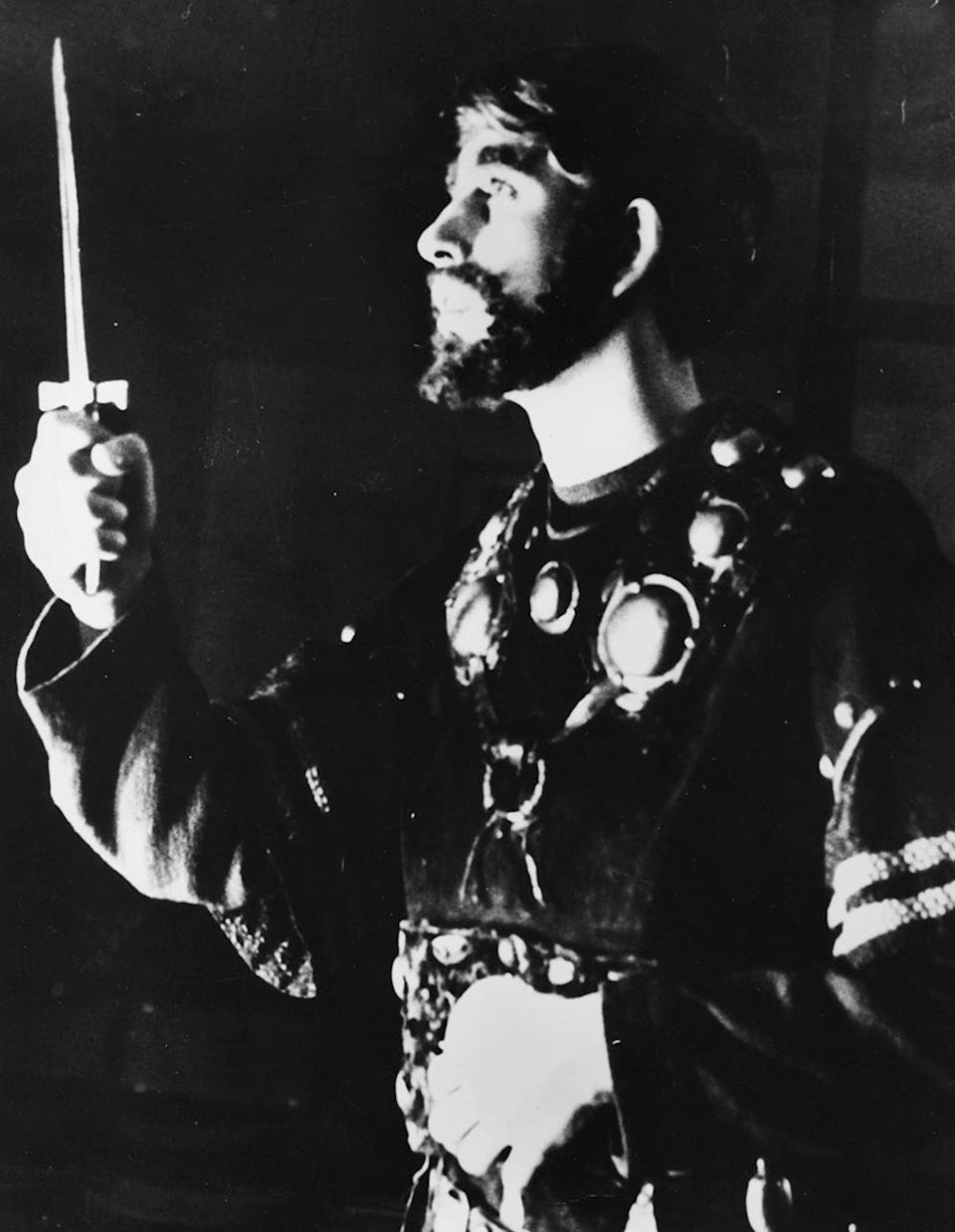 King Charles in costume acting out a scene.