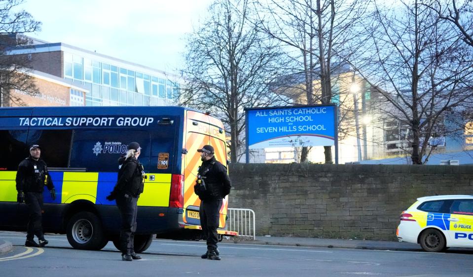 Police officers outside All Saints Catholic High School, on Granville Road in Sheffield, South Yorkshire, after a 15-year-old boy died following a stabbing incident at the school. Picture date: Monday February 3, 2025.