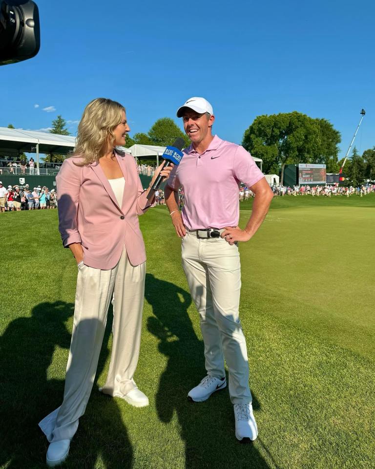 A reporter interviews a golfer on a golf course.