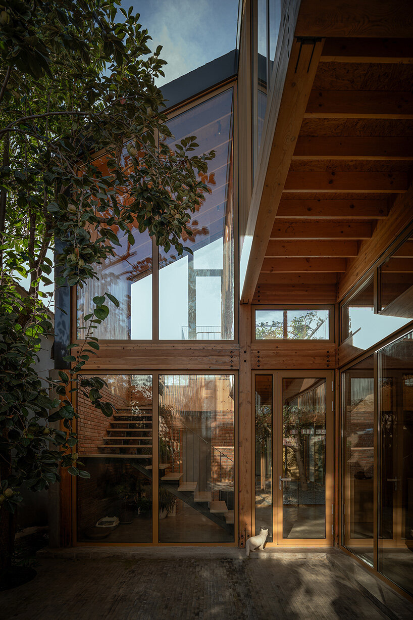 archstudio revives courtyard tradition with timber-framed guesthouse in beijing