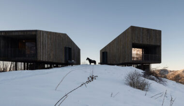 reclaimed weathered larchwood clads aum cabins' facades in kazakhstan