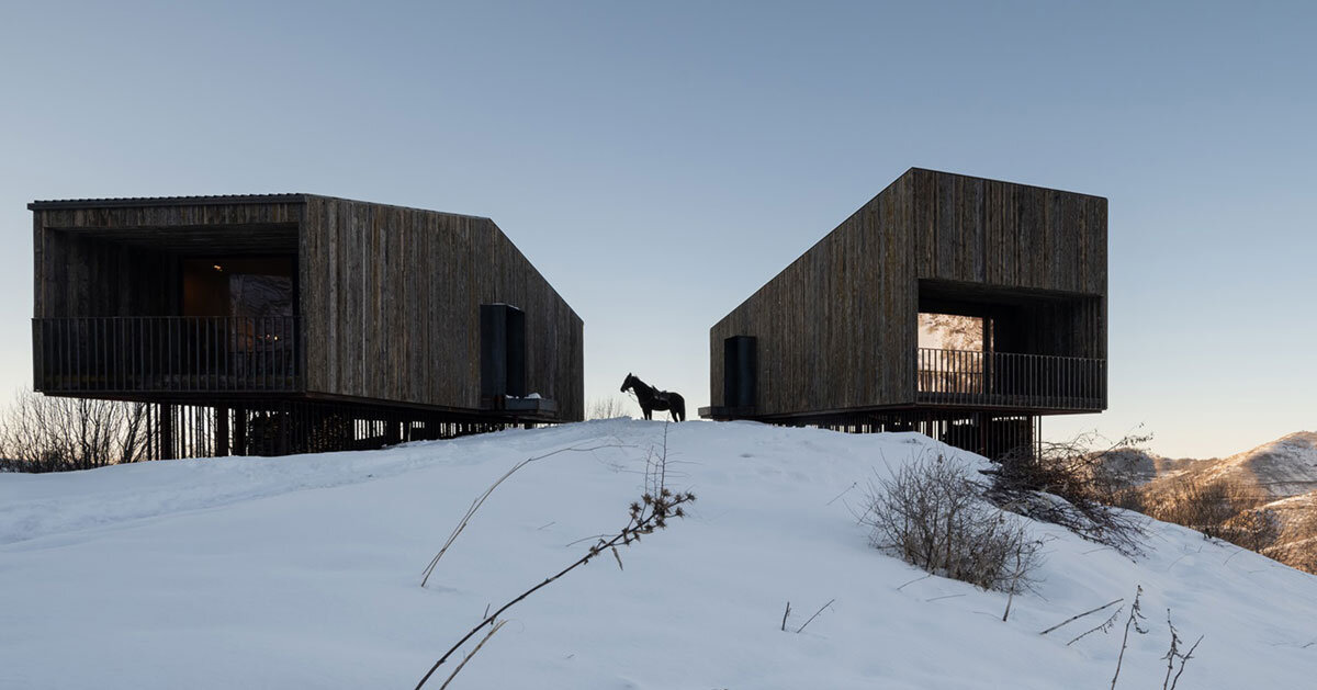 reclaimed weathered larchwood clads aum cabins' facades in kazakhstan