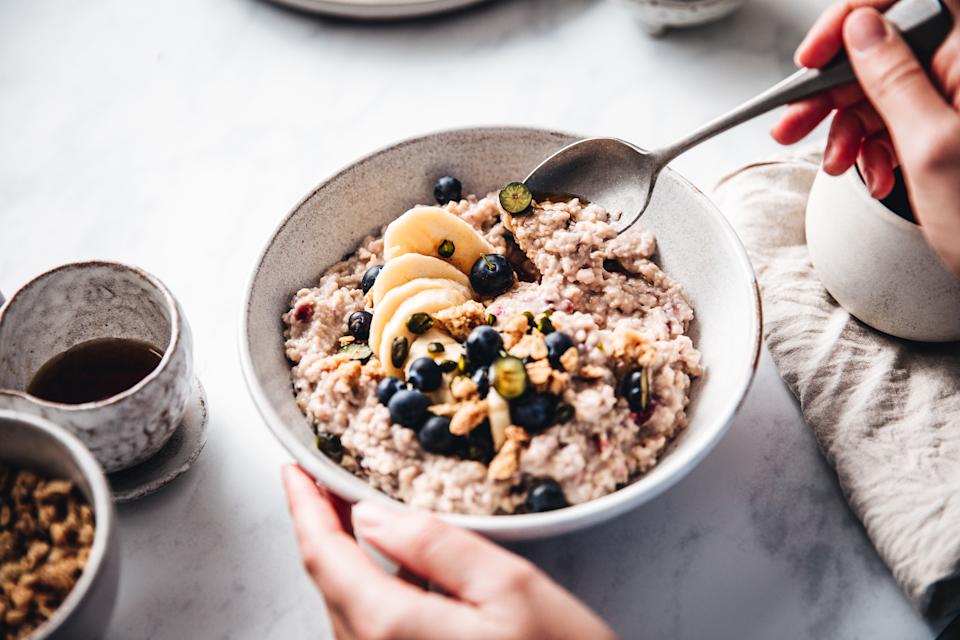 Close-up of a woman eating oats. 