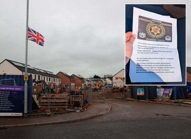 Resident in mixed housing estate warned they will be ‘burnt out’ if union flags erected by masked men removed