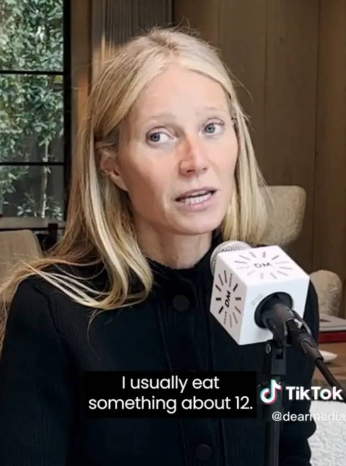 A person is speaking into a microphone indoors, discussing their eating habits. Text on image: "I usually eat something about 12."