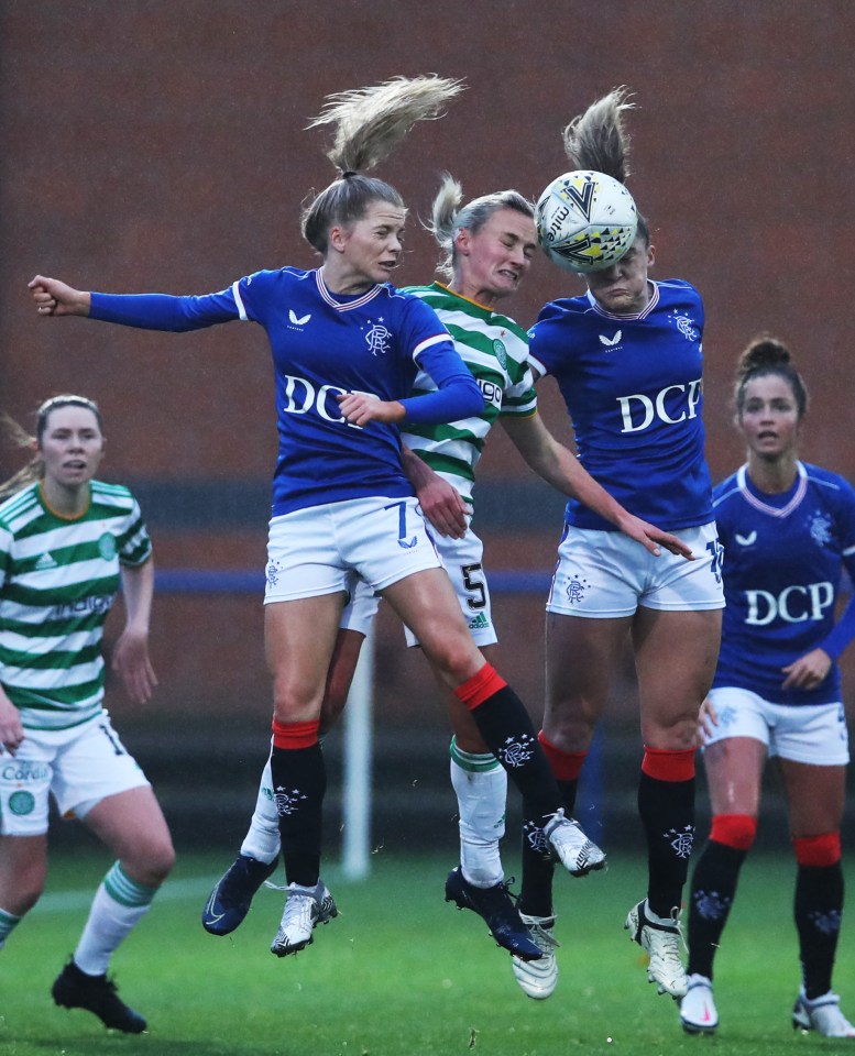 Rangers and Celtic women's soccer players vying for a header.