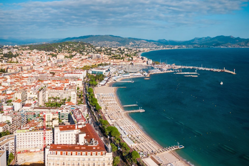 Aerial panoramic view of Cannes beach and harbor.