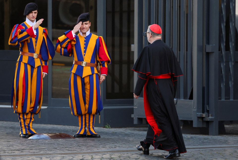 A cardinal arrives at the Vatican following the death of Pope Francis.