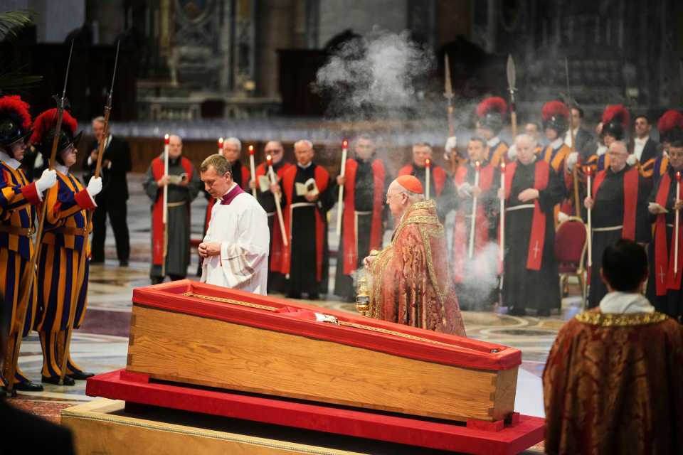 Cardinal Camerlengo Kevin Joseph Farrell incensing the body of Pope Francis lying in state.