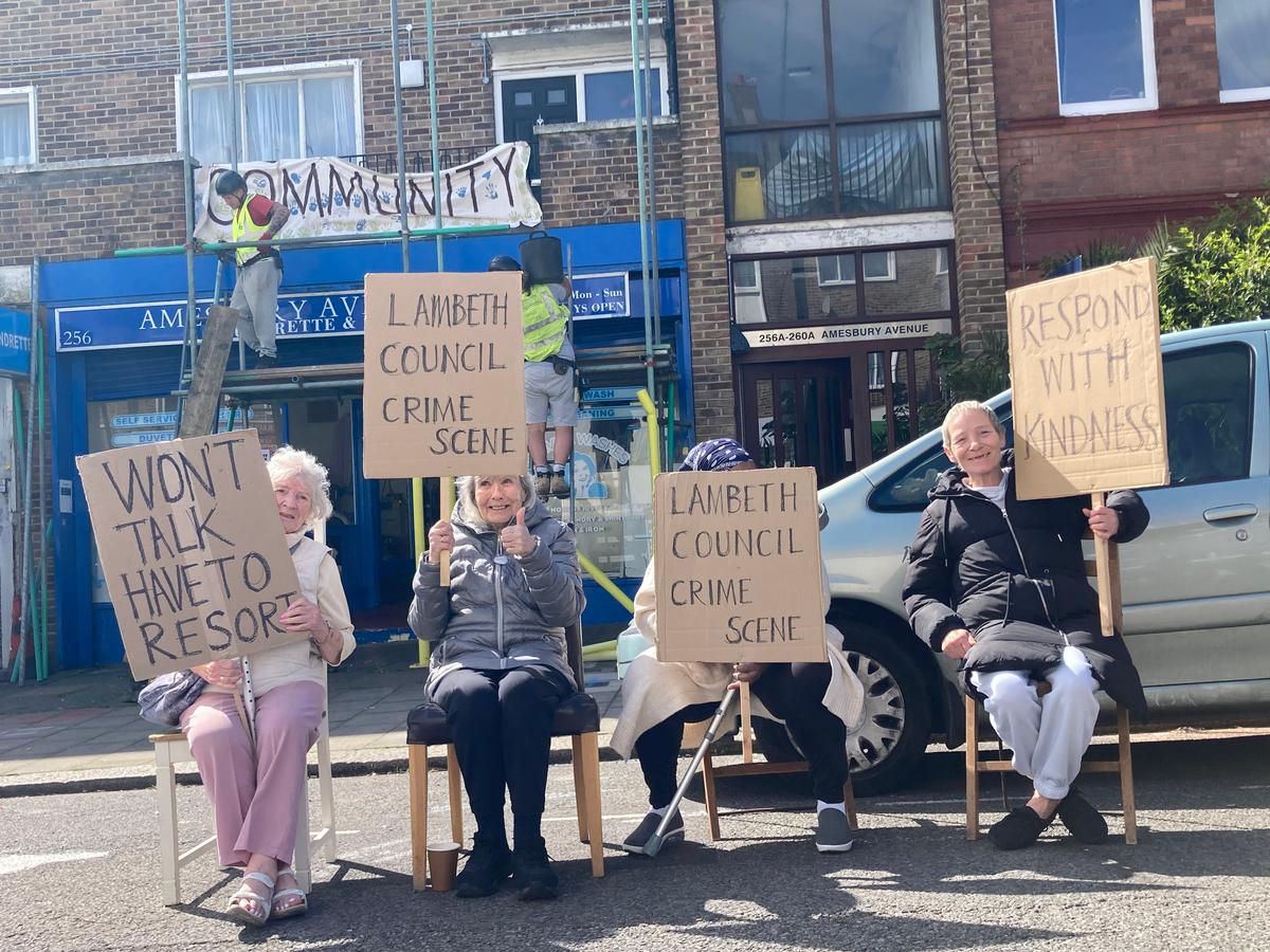 Residents block London street to stop work on controversial £650K plan to replace parking spaces with benches