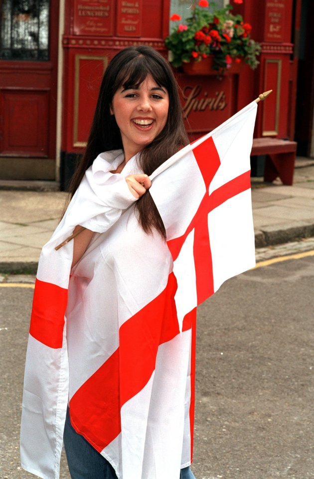 Carly Hillman, an EastEnders actress, holding an England flag.
