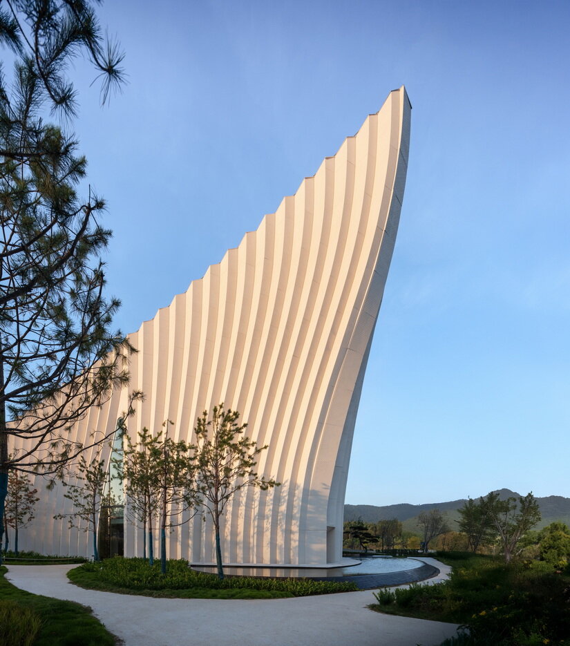 curved concrete roofs root atelier alter architects' museum into chinese mountain foothills