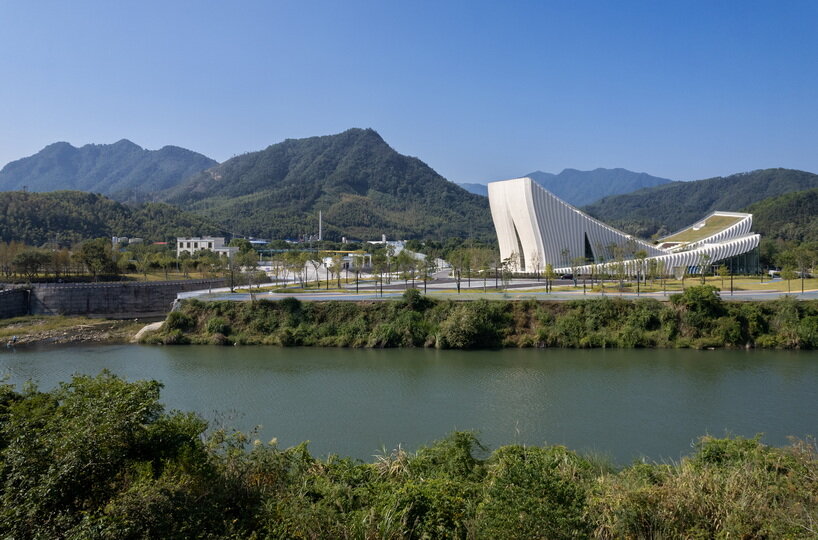 curved concrete roofs root atelier alter architects' museum into chinese mountain foothills