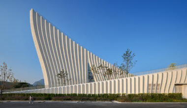 curved concrete roofs root atelier alter architects' museum into chinese mountain foothills