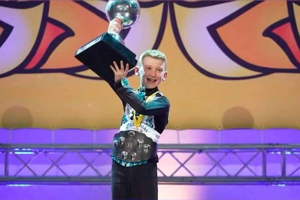 Ryan Maguire lifting his trophy