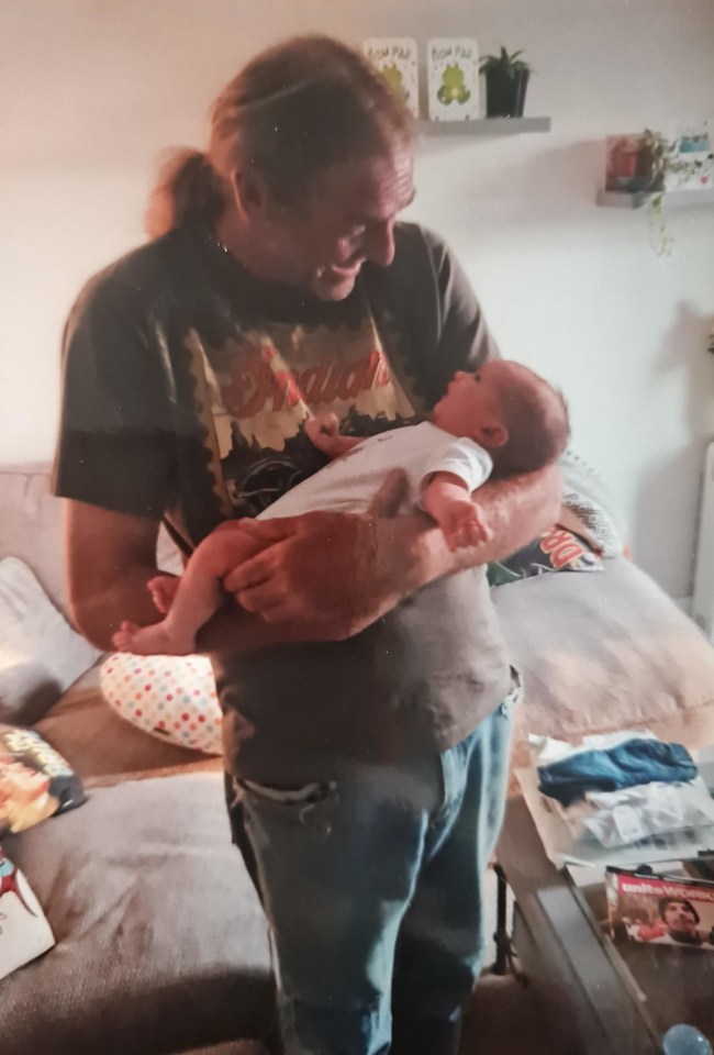 A man holding a baby.