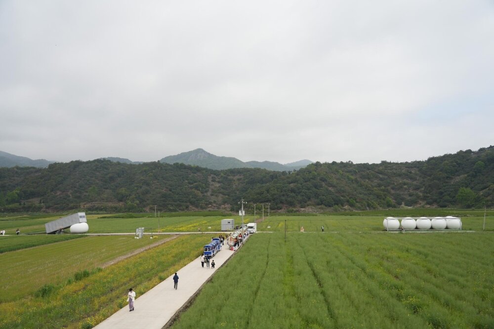 trio of inflated pavilions create rural café, cinema, and library amid rice fields in china