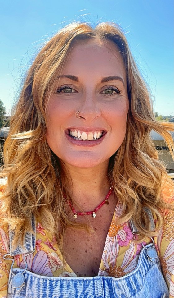 Woman smiling at the camera.