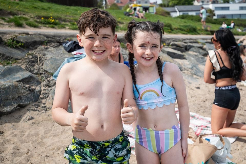 Joseph and Hollie enjoying the sunny weather at Helen's Bay beach on Wednesday. Pic: Luke Jervis/Belfast Telegraph