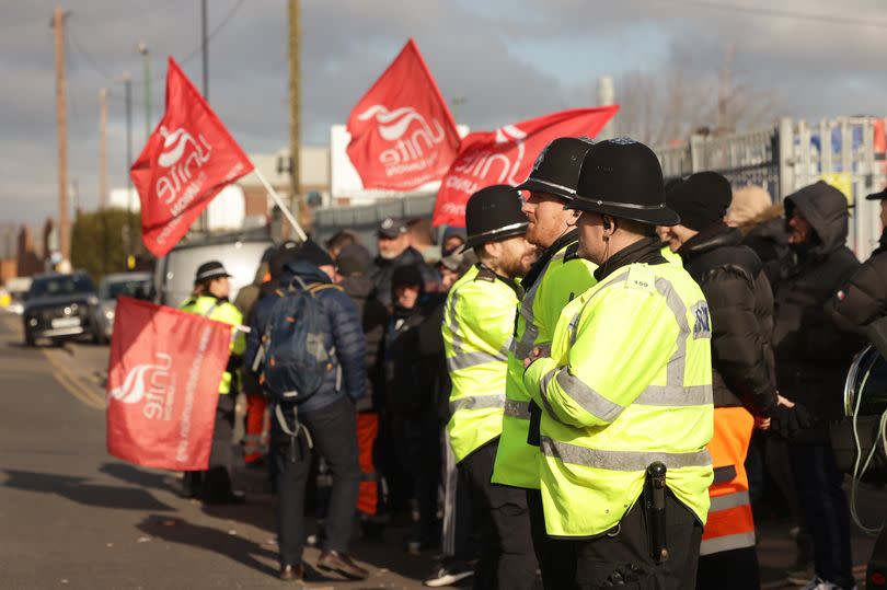 Unite the Union members outside the Atlas Depot in Redfern Road, Tyseley, pictured with police officers in attendance, at the start of the all-out strike