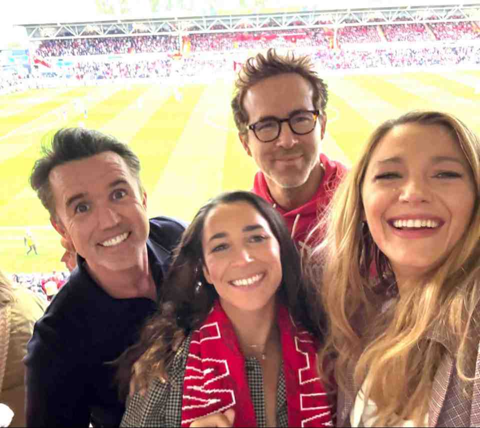 Photo of Ryan Reynolds, Blake Lively, and two other people at a soccer game.