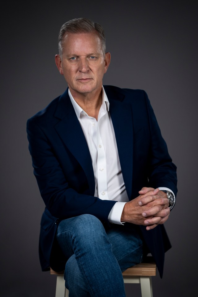 Jeremy Kyle in a navy blazer and jeans.